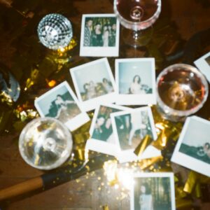 Wine Glasses And Pictures On Table